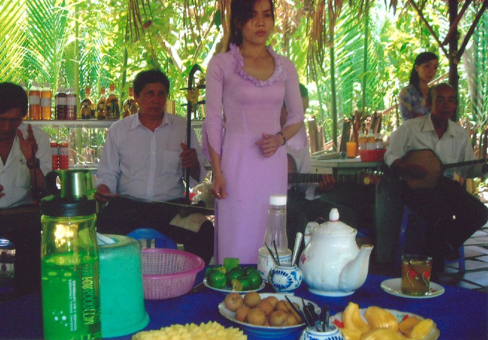 Singer and band at island restaurant